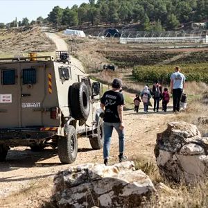 Youth of
Sumud accompanying Palestinian children.
